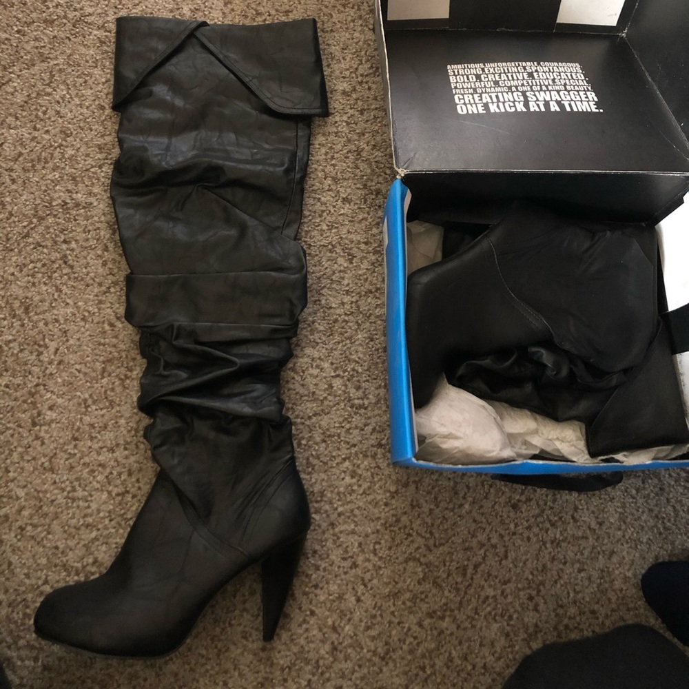 Black thigh high, leather like, heeled boots